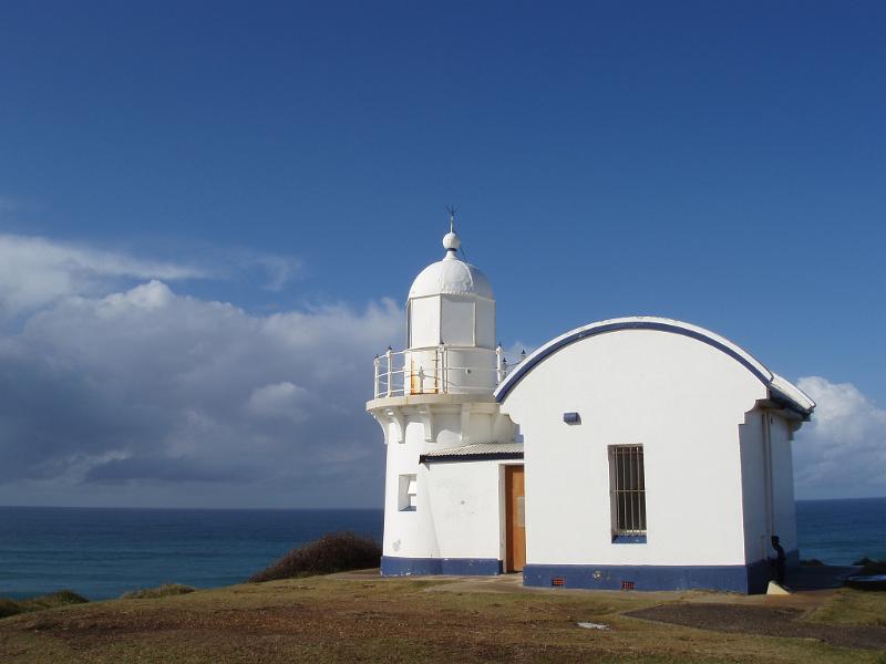 Free Stock Photo: Quaint whitewashed lighthouse on the northern coast of NSW, Australia overlooking the sea to aid shps in navigation or warn of a natural hazard