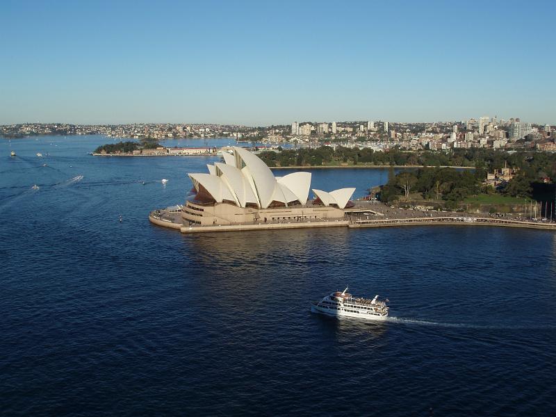 Free Stock Photo: Panoramic landscape view of Sydney opera house and the harbour with boat traffic in the bay, Sydney, Australia, in a tourism and travel concept