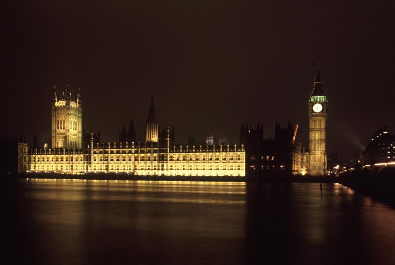 Free Stock Photo: Houses of Parliament and Big Ben, London, illuminated at night and reflected in the water of the River Thames below