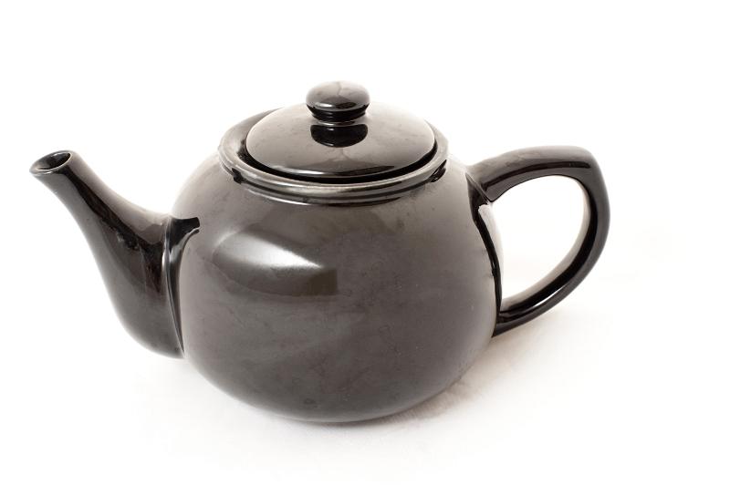 Free Stock Photo: Shiny isolated bulbous ceramic teapot for serving and brewing tea, side view on white