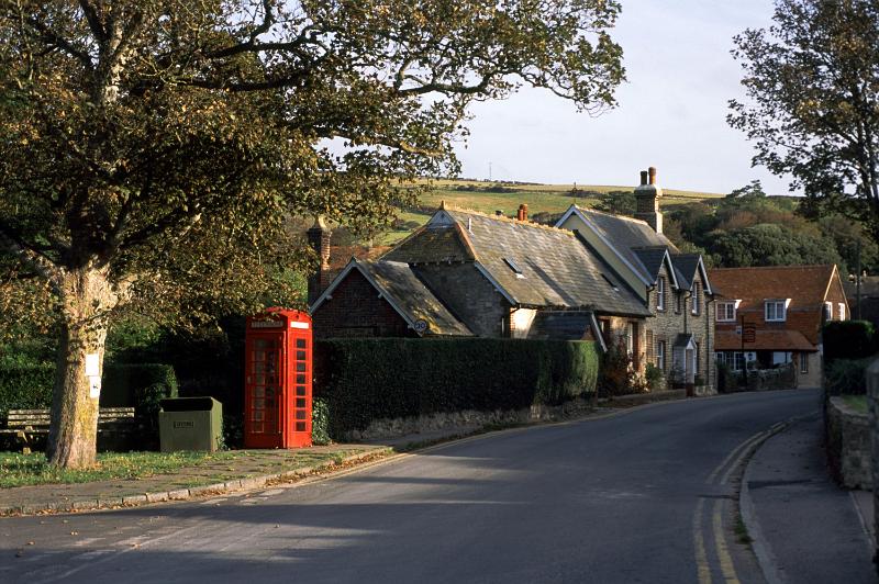 Free Stock Photo: Picturesque street in Lulworth Village with an iconic red public telephone booth and quaint English cottages