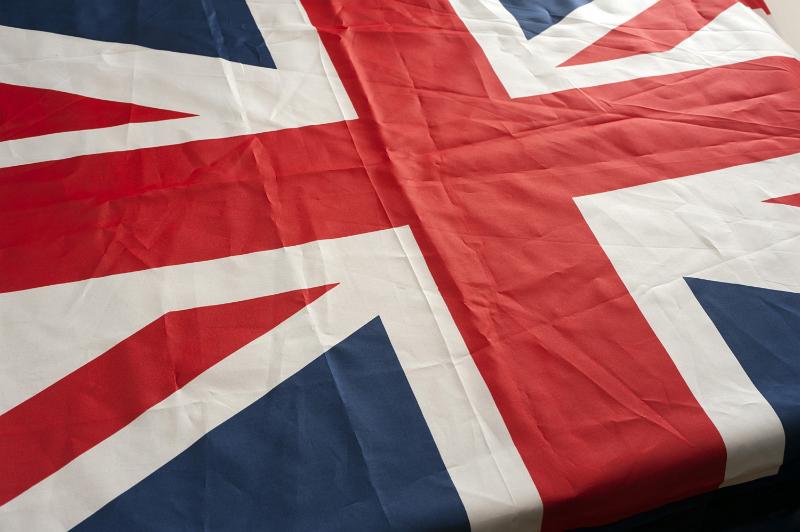 Free Stock Photo: Background with the British flag or Union Jack, the national emblem of the United Kingdom, viewed lying at an oblique angle