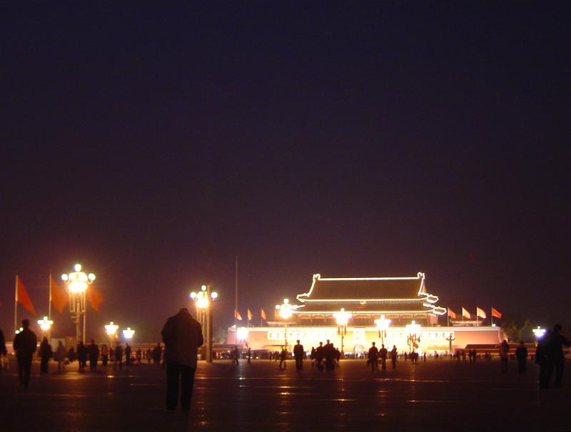 Free Stock Photo: Silhouettes of Visitors in front of Illuminated Gate or Building in Forbidden City, Chinese Imperial Palace in Beijing, China
