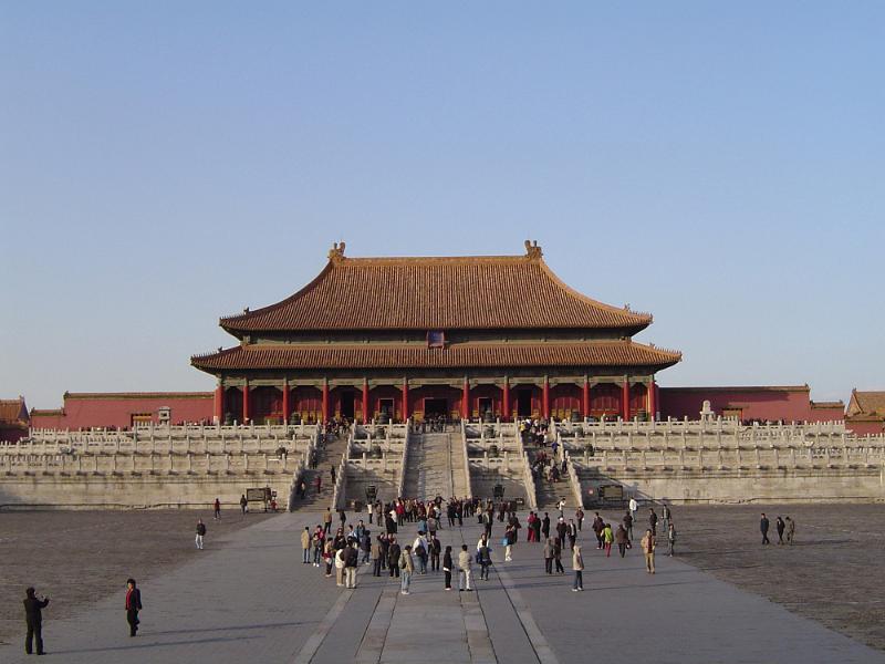 Free Stock Photo: Landscape view of the exterior facade of a temple in the Forbidden City, Beijing, China with groups of people in the foreground in a travel and tourism concept