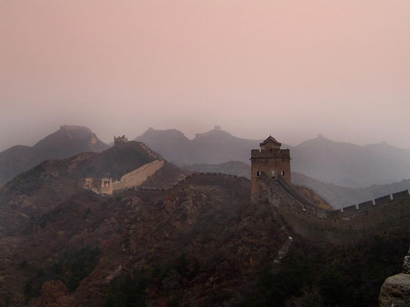 Free Stock Photo: Atmospheric scenic landscape in colorful mist of the Great Wall of China and its lookout towers stretching away across mountain peaks in a travel concept