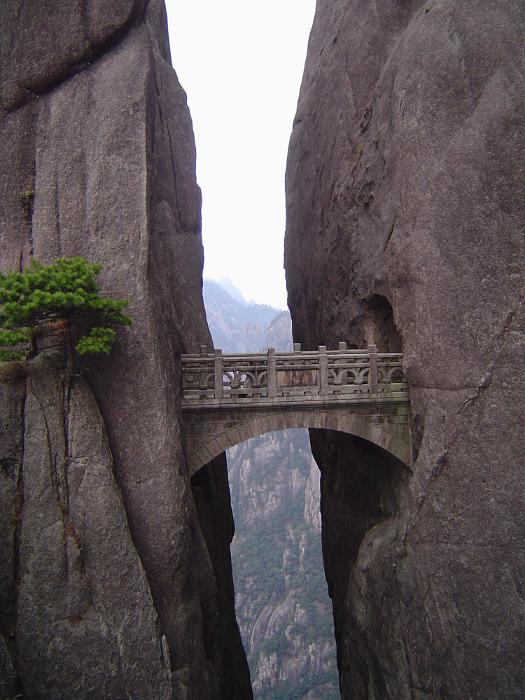Free Stock Photo: Beautifully Carved Stone Arch Bridge Through Granite Tunnels and Across Gap in Huangshan Mountains in Eastern China