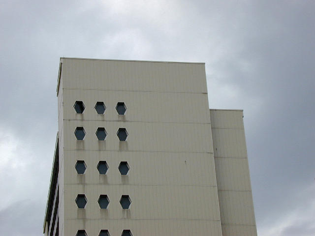 Free Stock Photo: hexagonal windows on the end of a 60's office tower