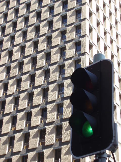 Free Stock Photo: green traffic signal and office building, symbolic of green light for commerce and business