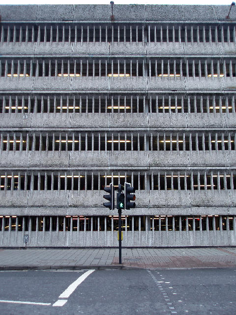 Free Stock Photo: bleak urban concrete, a pedestrian crossing infront of a multistory carpark, cardiff england,