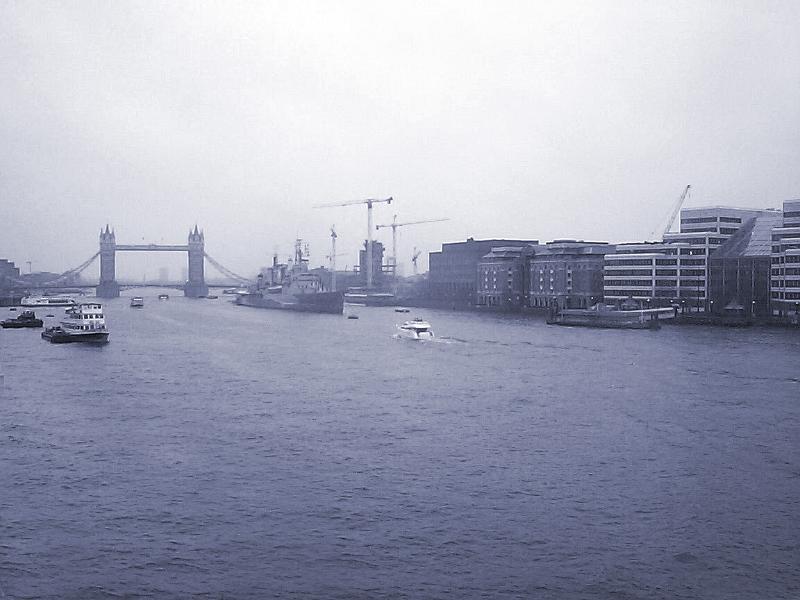 Free Stock Photo: Overview of Boat Traffic and Building Development Along the River Thames with View of Tower Bridge in Background on Hazy Overcast Day in London, England