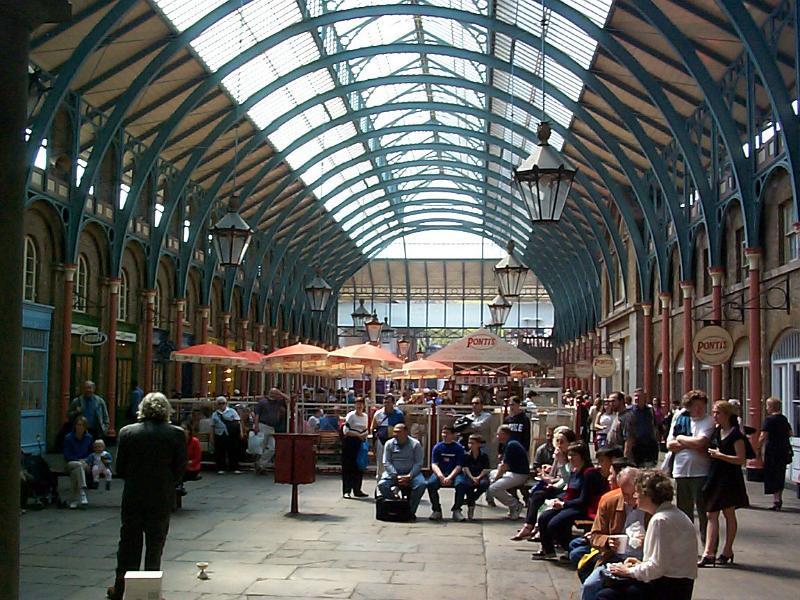 Free Stock Photo: Interior of Covent Garden, London, once a fruit and produce market but now a shopping precinct with groups of shoppers under its arched glass roof
