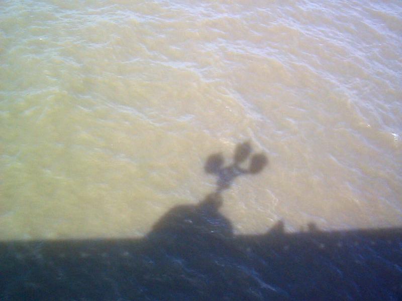 Free Stock Photo: Westminster Bridge shadow cast on the rippling water of the Thames River in a background texture, London, UK