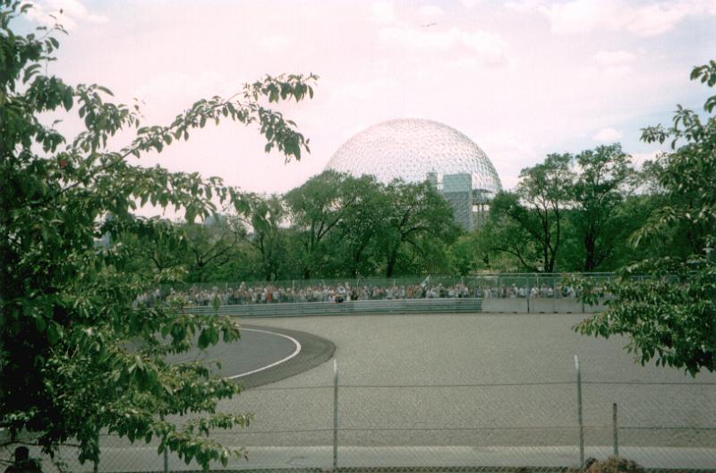 Free Stock Photo: Montreal Biosphere dome museum viewed from distance with lots of green foliage and city park in foreground. Quebec, Canada