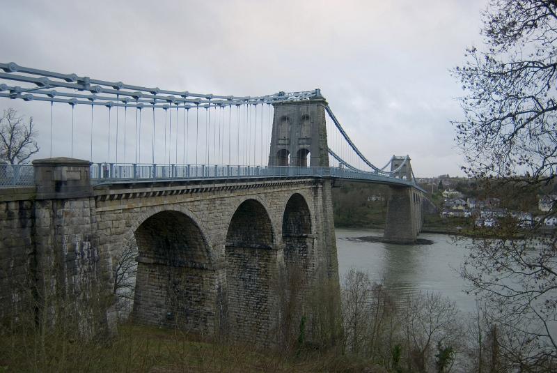 Free Stock Photo: Menai suspension bridge on the Isle of Anglesey, Wales on an overcast cloudy day viewed from the bank