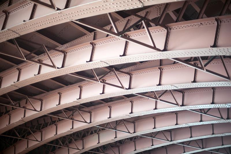 Free Stock Photo: Steel arch bridge from below with arched beams and cross metal trusses, viewed from low angle in full frame