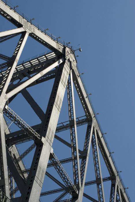 Free Stock Photo: Massive steel bridge frame viewed from low angle against clear blue sky