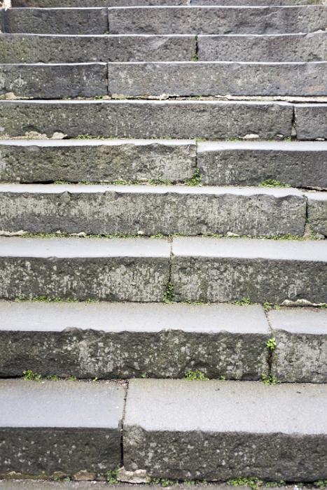 Free Stock Photo: Exterior flight of stone steps or stairs viewed from the bottom looking up in a close up full frame view