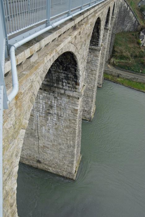 Free Stock Photo: High stone arch bridge across the river with metal railings viewed from high angle