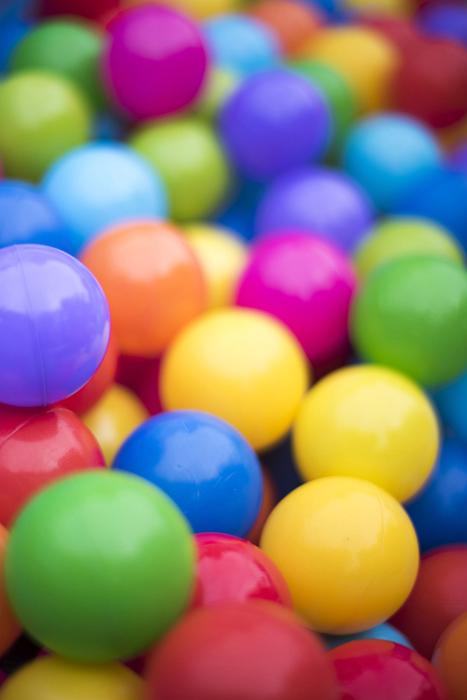 Free Stock Photo: Colorful background of multicolored plastic balls in a ball pool with shallow dof in vertical format