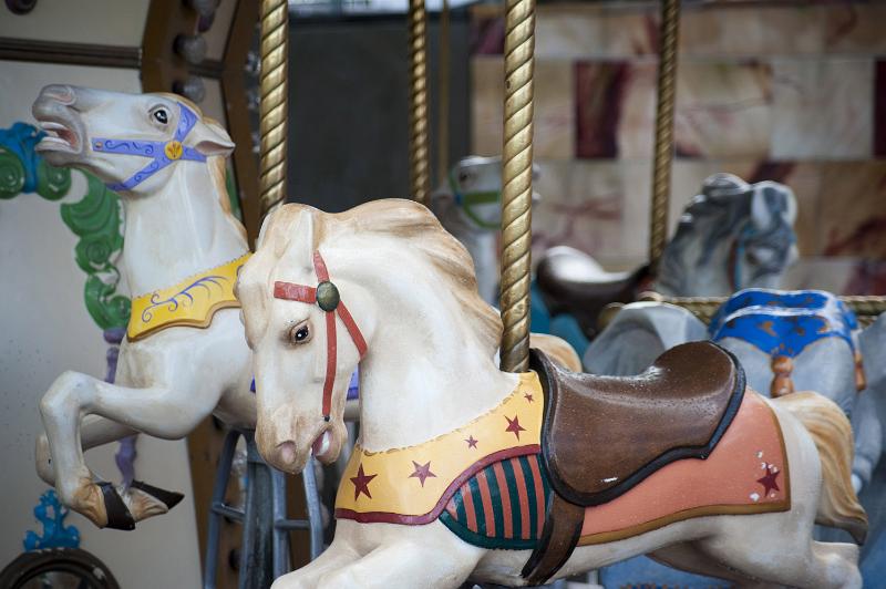 Free Stock Photo: A close up of horses on empty merry-go-round amusement park ride.