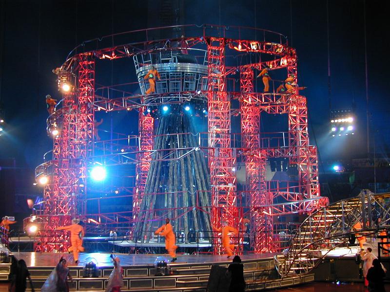 Free Stock Photo: Acrobats performing in a circus show in a Big Top on a centre stage lit by spotlights