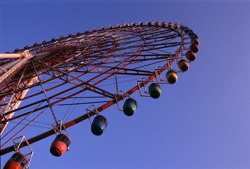 Free Stock Photo: A low angle of a giant ferris wheel and clear, blue sky.