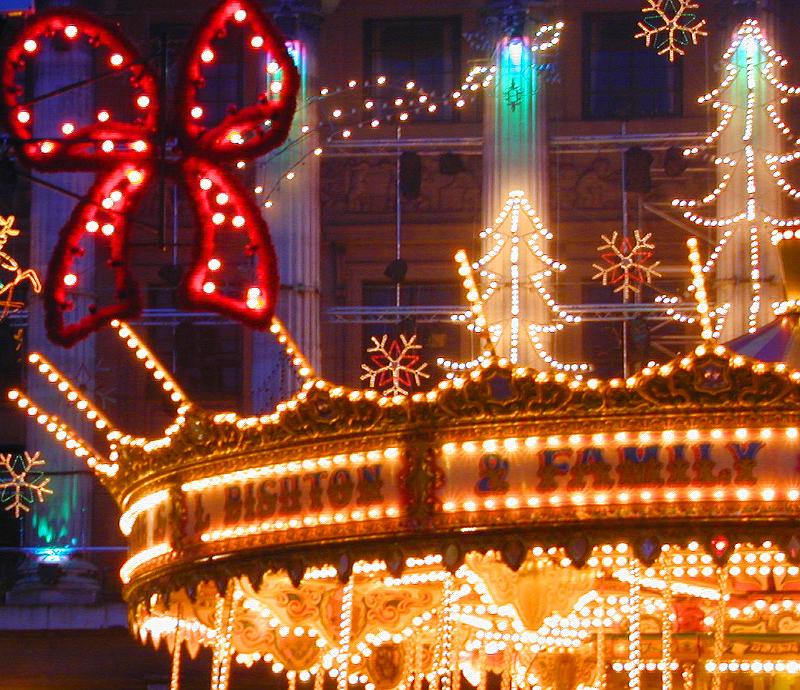 Free Stock Photo: A close up of Christmas themed amusement park lights at night.