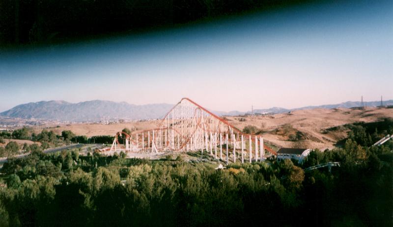 Free Stock Photo: Distant roller coaster track in hilly landscape in countryside