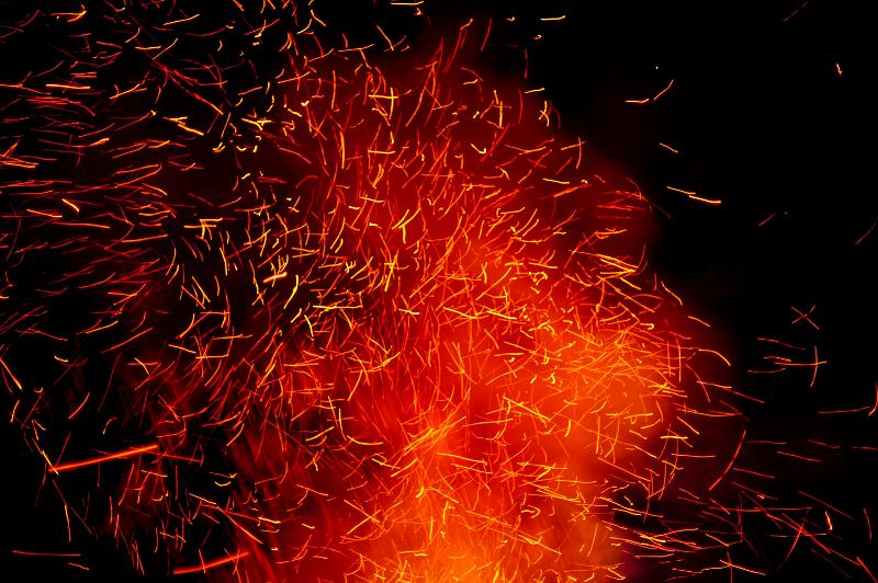 Free Stock Photo: Bonfire with fiery sparks shooting orange flames into the night sky