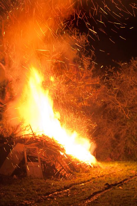 Free Stock Photo: Roaring bonfire with flying embers alongside a rural track shooting fiery orange flames into the night sky