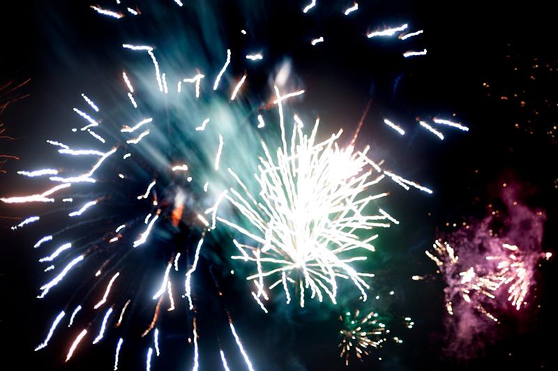 Free Stock Photo: Colorful pyrotechnics display of bursting fireworks in a night sky celebrating a holiday or festival