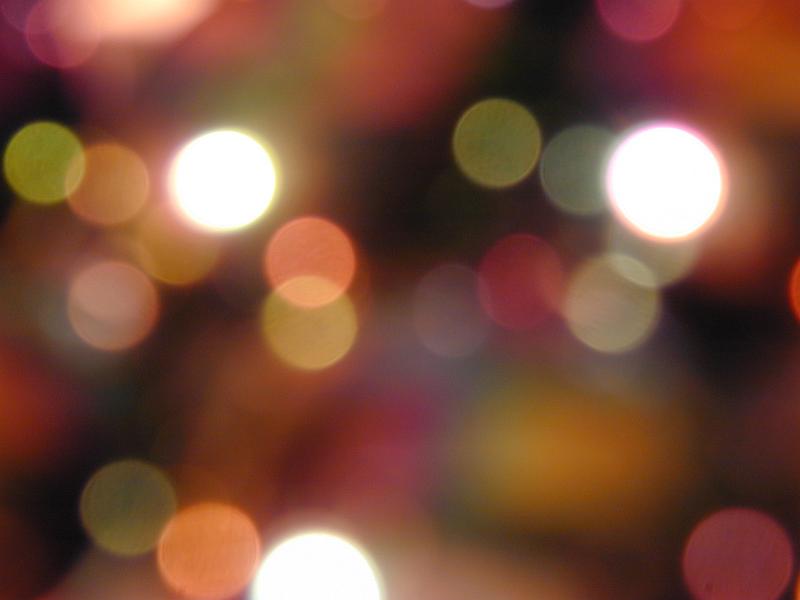 Free Stock Photo: Festive background bokeh of colorful party lights celebrating a special event or seasonal holiday, full frame