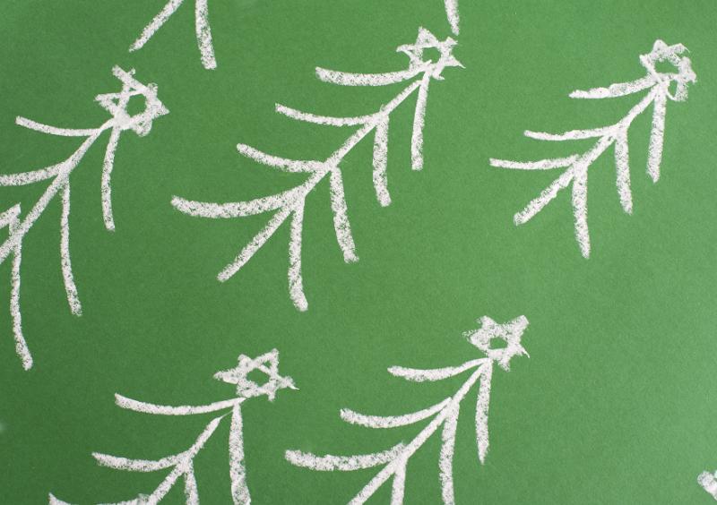 Free Stock Photo: Chalk hand-drawn Christmas trees forming a diagonal pattern on a green chalkboard for a festive Xmas background