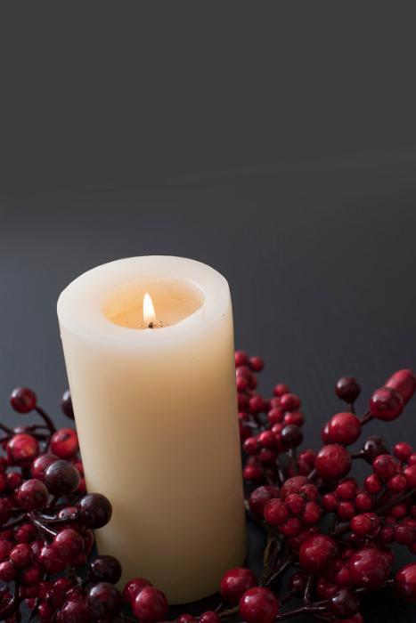 Free Stock Photo: a lit christmas advent candle or table centre with red berries