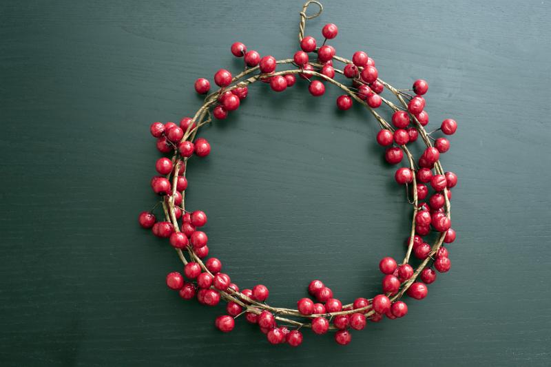 Download image of Red cranberry berry wreath for Christmas Free Stock Photo: Red cranberry circular berry wreath for Christmas over a drak background with copy space for a seasonal greeting