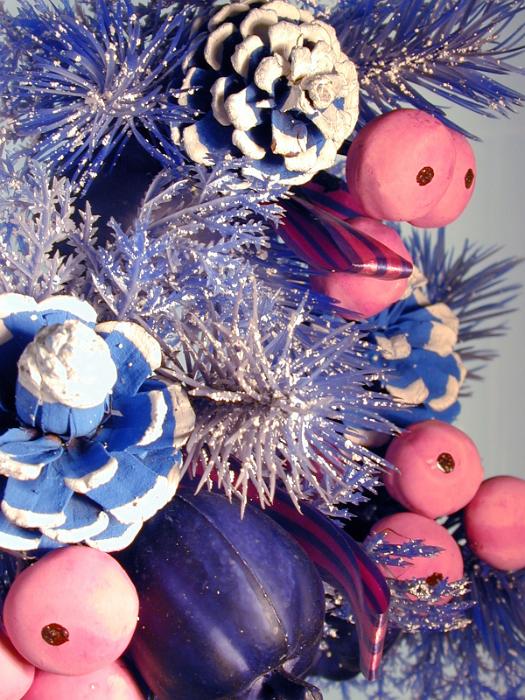 Free Stock Photo: Detail of Glitzy Christmas Decoration - Close Up of Purple Plastic Evergreen Tree Branches Accented with Painted Pine Cones, Baubles and Sparkling Glitter