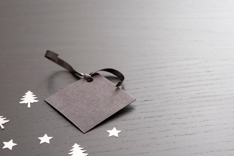 Free Stock Photo: a blank christmas gift tag on dark background with silver trees and stars