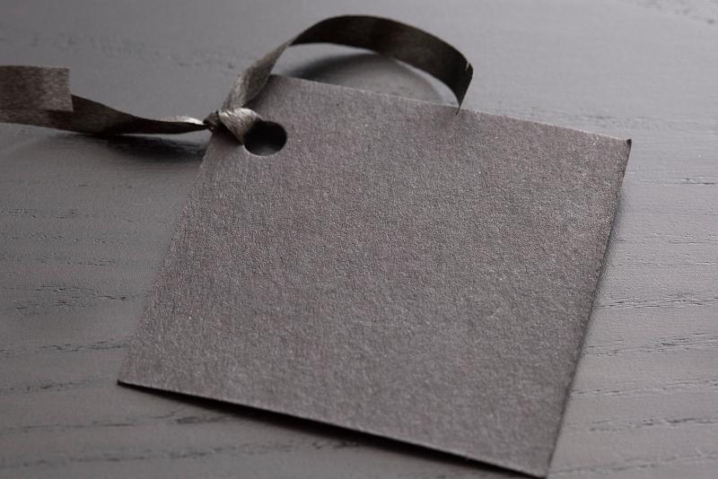 Free Stock Photo: a plain black paper gift tag with space to add text