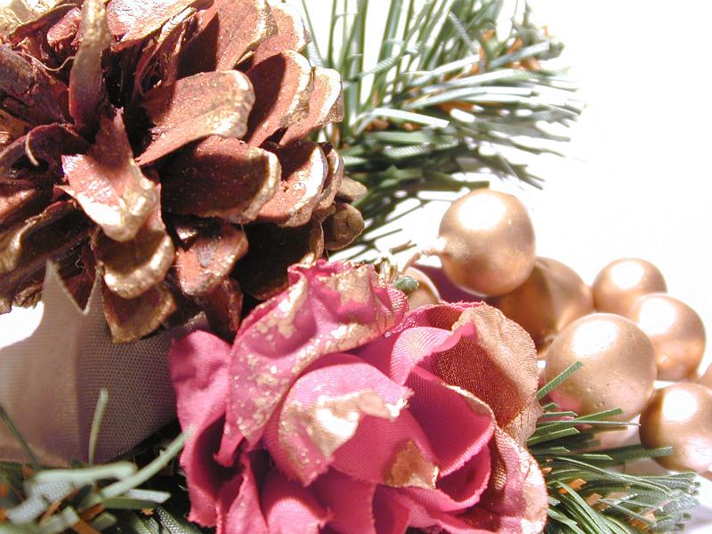 Free Stock Photo: Extreme Close Up Detail of Festive Christmas Decoration Made from Gold Painted Pine Cones, Evergreen Sprigs and Ornamental Balls