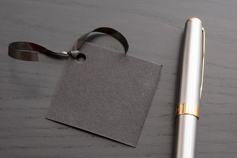 Download image of gift tag and pen Free Stock Photo: a pen waiting to write a name on a gift tag