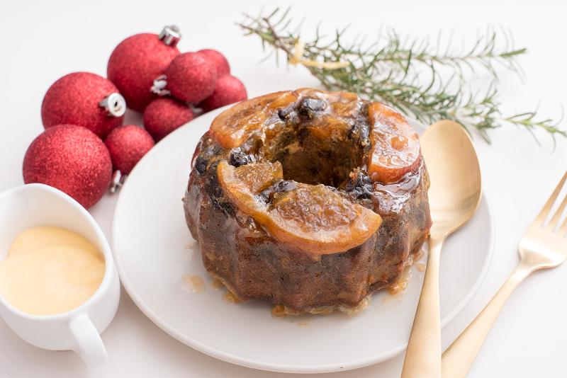 Download image of christmas fruit pudding Free Stock Photo: traditional round, christmas fruit pudding on a plate with brandy custard