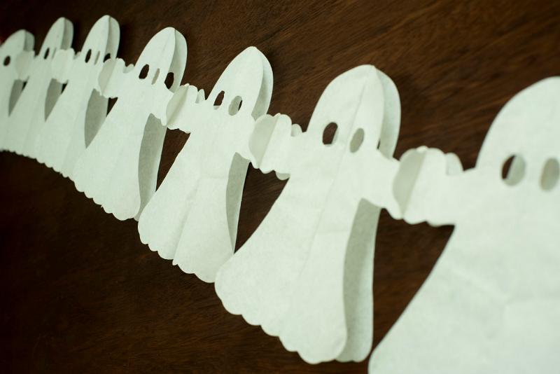 Free Stock Photo: a string of green glowing halloween ghost decorations pictured at an angle
