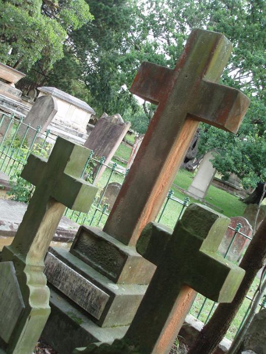 Free Stock Photo: three cross shaped stone headstones in graveyard