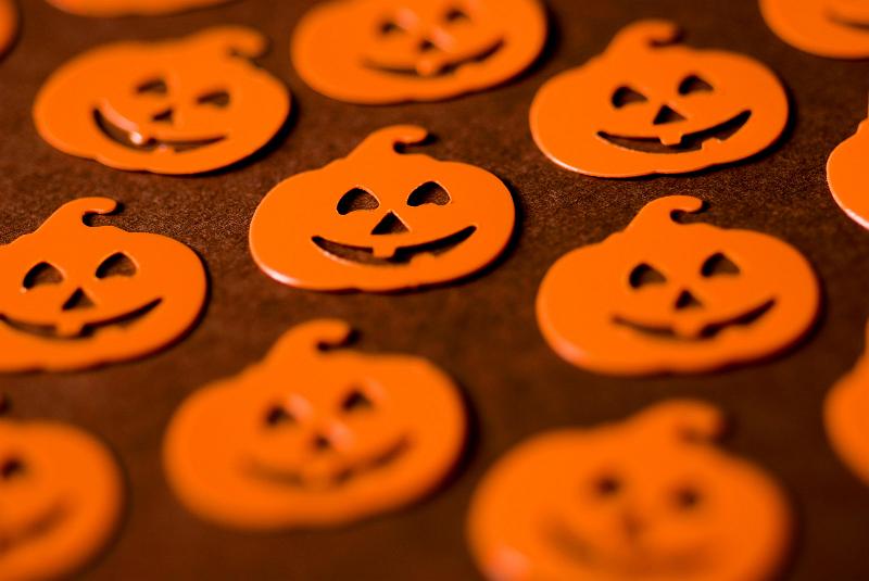 Free Stock Photo: jack-o-lantern pumpkin halloween shapes in orange on a brown backdrop