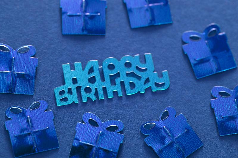Free Stock Photo: a blue background with metallic blue happy birthday shape and presents