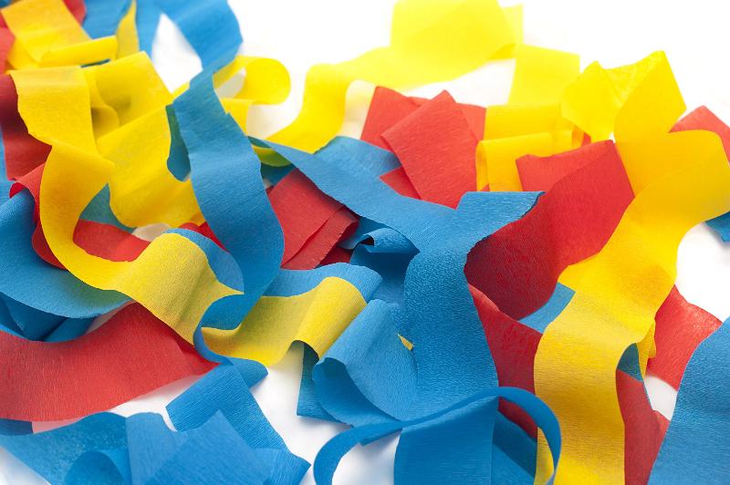 Free Stock Photo: Jumble of Unravelled Rolls of Crepe Paper Streamers on White Background