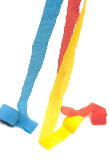 Free Stock Photo: Rolls of Colorful Crepe Paper Streamers Unravelling on White Background