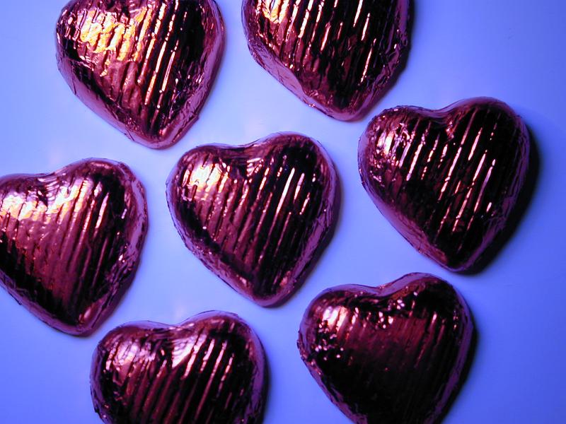Free Stock Photo: pink coloured valentines chocolate treat heart shapes