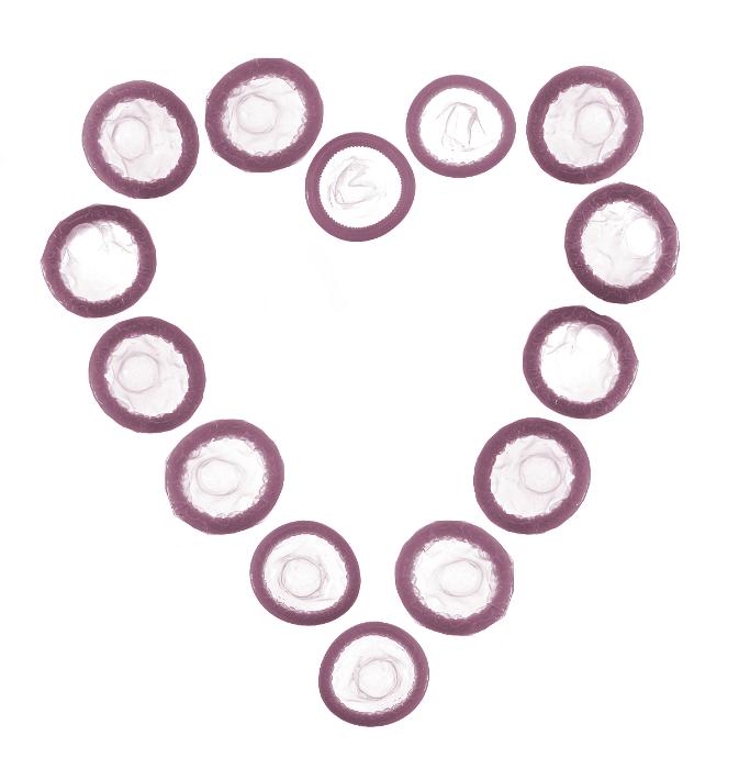 Download image of Heart shaped condoms Free Stock Photo: condoms arranged into a love heart shape, concept of valentines and safe sex