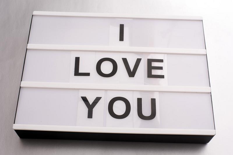 Free Stock Photo: Tender I Love You Valentines Day message on a small light box over a graduated grey to white background